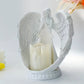 Lysestake med figur av bedende engel