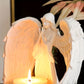 Lysestake med figur av bedende engel