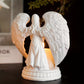Lysestake med figur av bedende engel