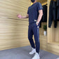 2-delt sett med kortermet topp og joggebukse med høy stretch for menn